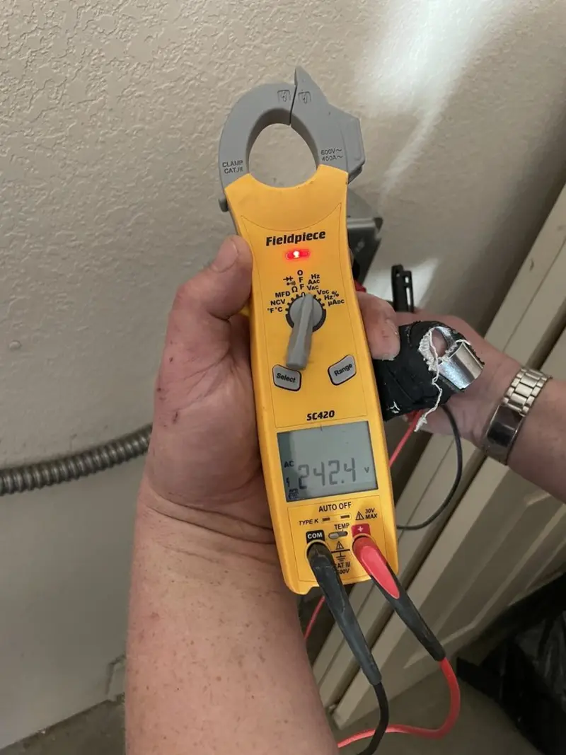 Voltage testing with clamp meter during Generator Installation in Troy